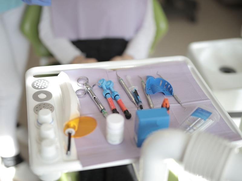 Dental instruments arranged on a clinic tray