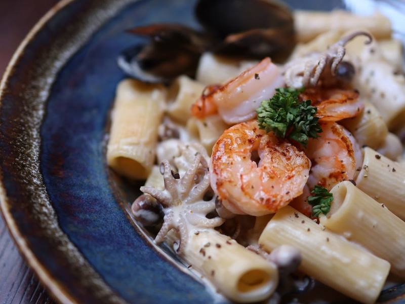 Pasta with shrimp and mussels in a creamy seafood sauce